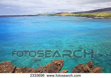 A view of La Perouse Bay with clear water and coral; Maui, Hawaii, United States of America View Large Photo Image Stock Photograph - A view of La Perouse Bay with clear water and coral; Maui, Hawaii, United States of America. Fotosearch