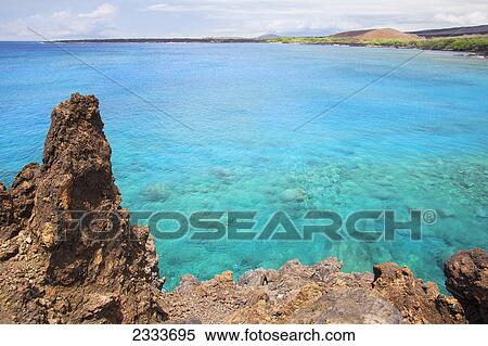 Stock Photography - A view of La Perouse Bay with clear water and coral; Maui, Hawaii, United States of America. Fotosearch