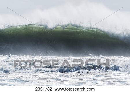 A wave breaking on the shore; Tarifa cadiz andalusia spain View Large Photo Image Stock Image - A wave breaking on the shore; Tarifa cadiz andalusia spain. Fotosearch