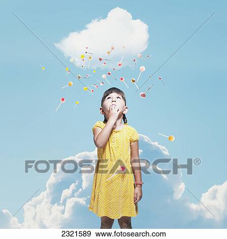 A Young Girl With Floating Candy Above Her Head; Malaga Andalusia Spain View Large Photo Image Stock Photo - A Young Girl With Floating Candy Above Her Head; Malaga Andalusia Spain. Fotosearch