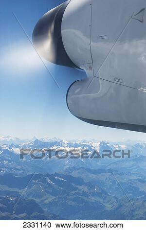 Airplane propeller flying over the swiss alps; Switzerland View Large Photo Image Stock Image - Airplane propeller flying over the swiss alps; Switzerland. Fotosearch