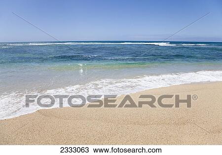 Stock Image - An empty shore on the coast of oahu; Honolulu oahu hawaii united states of america. Fotosearch