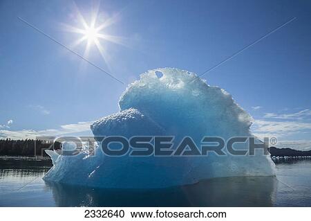 An iceberg glows in the late afternoon sun in tongass national forest inside passage; Alaska united states of america View Large Photo Image Stock Image - An iceberg glows in the late afternoon sun in tongass national forest inside passage; Alaska united states of america. Fotosearch