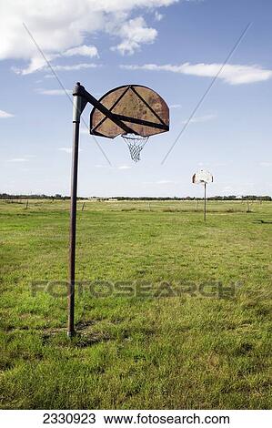 Basketball nets in a grass field; Saskatchewan canada View Large Photo Image Stock Image - Basketball nets in a grass field; Saskatchewan canada. Fotosearch