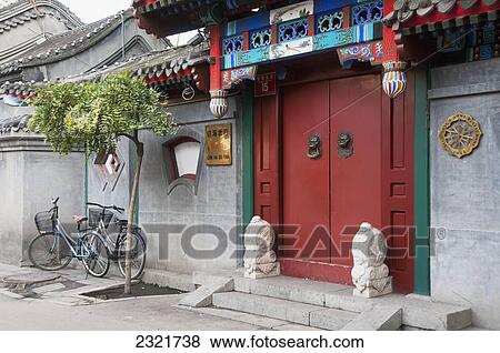 Bicycles Parked Outside A Building With Red Doors In The Hutong Area; Beijing China View Large Photo Image Stock Photo - Bicycles Parked Outside A Building With Red Doors In The Hutong Area; Beijing China. Fotosearch
