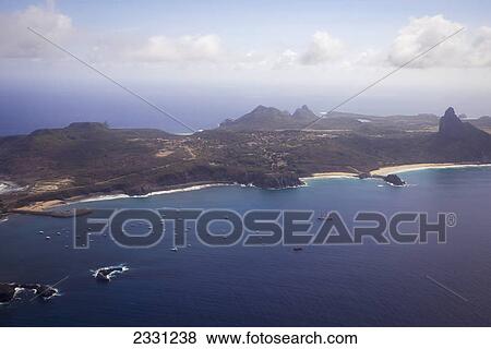 Boats in the water along the coastline; Fernando de noronha pernambuco brazil View Large Photo Image Stock Photo - Boats in the water along the coastline; Fernando de noronha pernambuco brazil. Fotosearch