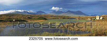 Boglake with twelve bens in the distance in connemara; County galway ireland View Large Photo Image Stock Photography - Boglake with twelve bens in the distance in connemara; County galway ireland. Fotosearch