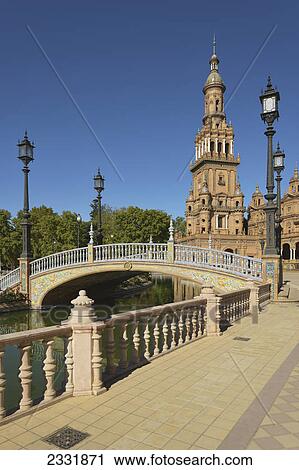 Stock Image - Bridge over water in the plaza de espana; Seville andalusia spain. Fotosearch