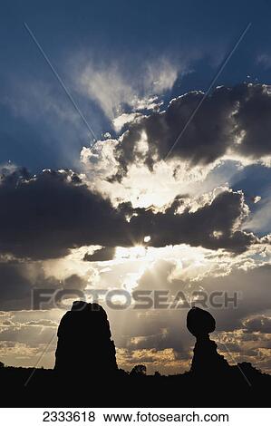 Brilliant cloud formations behind balanced rock in arches national park; Moab utah united states of america View Large Photo Image Stock Photo - Brilliant cloud formations behind balanced rock in arches national park; Moab utah united states of america. Fotosearch