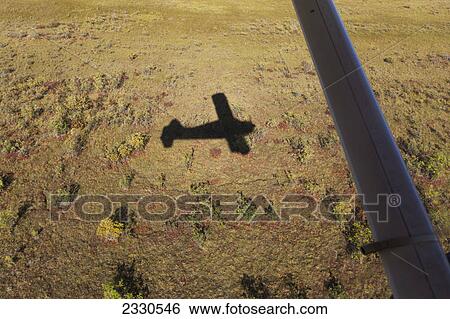 Stock Photograph - Bush plane flying over brooks range gates of the arctic national park northwestern alaska; Alaska united states of america. Fotosearch