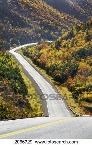 Cabot Trail Winds Through Autumn Colors In Cape Breton Highlands National Park. View Large Photo Image Stock Photo - Cabot Trail Winds Through Autumn Colors In Cape Breton Highlands National Park.. Fotosearch