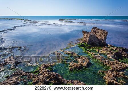 Stock Image - Caesarea maritima a national park on the israeli coastline near the town of caesarea; Caesarea israel. Fotosearch