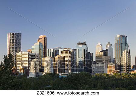Calgary Skyline At Sunrise With Blue Sky; Calgary Alberta Canada View Large Photo Image Stock Photograph - Calgary Skyline At Sunrise With Blue Sky; Calgary Alberta Canada. Fotosearch