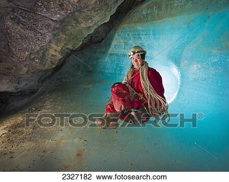 Cave explorer sitting in ice-plug depression with ropes; Crowsnest pass alberta canada View Large Photo Image Stock Image - Cave explorer sitting in ice-plug depression with ropes; Crowsnest pass alberta canada. Fotosearch