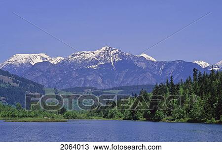 Stock Image - Cayoosh Mountain Range Rises Behind One Mile Lake, Near Pemberton. Fotosearch