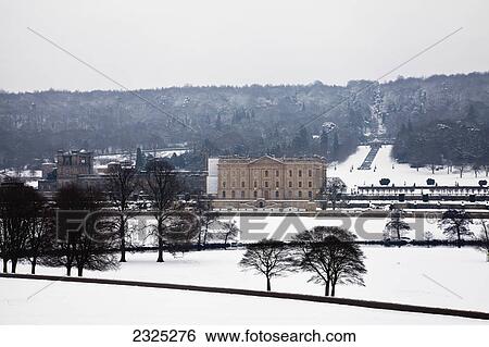 Stock Photograph - Chatsworth house in peak district national park in winter; Derbyshire england. Fotosearch
