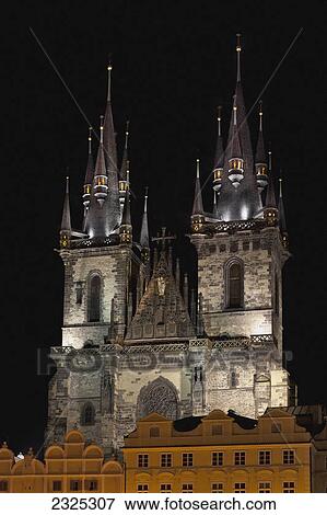 Church building with two towers illuminated at night; Prague czech republic View Large Photo Image Stock Photo - Church building with two towers illuminated at night; Prague czech republic. Fotosearch