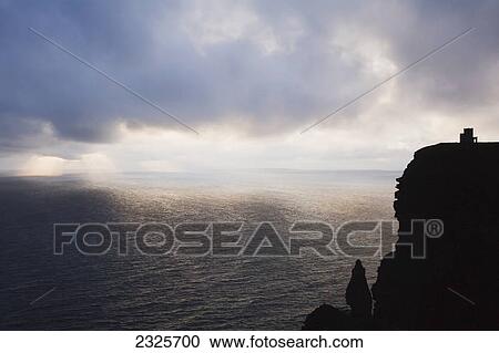 Stock Image - Cliffs of moher at sunset; County clare ireland. Fotosearch