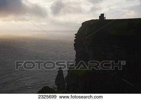 Stock Photo - Cliffs of moher at sunset; County clare ireland. Fotosearch