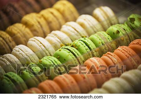Stock Photography - Close Up Of Coloured Macaroons In Store Window Display; Milano Lombardia Italy. Fotosearch