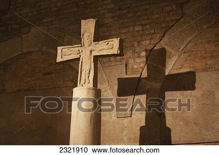 Close Up Of Stone Cross/Crucifix With A Shadow On Brick Wall In Background; Bologna Emilia-Romagna Italy View Large Photo Image Stock Image - Close Up Of Stone Cross/Crucifix With A Shadow On Brick Wall In Background; Bologna Emilia-Romagna Italy. Fotosearch