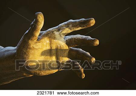 Stock Image - Close Up Of The Statue Hand Of Neptune; Bologna Emilia-Romagna Italy. Fotosearch