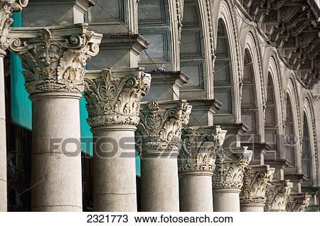 Stock Image - Close Up Of The Tops Of A Row Of Corinthian Columns And Arches; Milano Lombardia Italy. Fotosearch