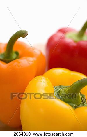 Close-Up Of Yellow, Orange And Red Peppers View Large Photo Image Stock Image - Close-Up Of Yellow, Orange And Red Peppers. Fotosearch