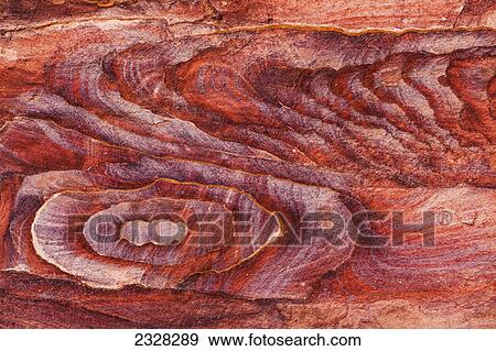Coloured stone eroded in a design; Petra jordan View Large Photo Image Stock Photo - Coloured stone eroded in a design; Petra jordan. Fotosearch