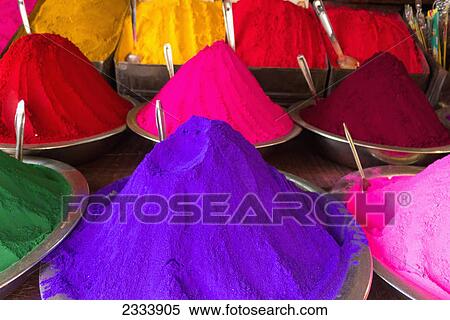 Stock Photography - Conical piles of kumkum (coloured powder used for bindi dots and pujas) at Devaraja Market; Mysore, Karnataka, India. Fotosearch
