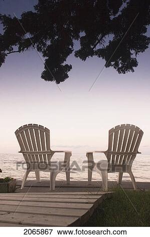 Cottage Chair At Lake Manitoba, Canada View Large Photo Image Stock Photo - Cottage Chair At Lake Manitoba, Canada. Fotosearch