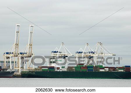 Cranes Load Containers Onto Cargo Ships, Tsawwassen, Bc, Canada View Large Photo Image Stock Image - Cranes Load Containers Onto Cargo Ships, Tsawwassen, Bc, Canada. Fotosearch