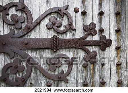 Decorative Metal Pieces Rusted On A Wooden Wall; Dumfries And Galloway Scotland View Large Photo Image Picture - Decorative Metal Pieces Rusted On A Wooden Wall; Dumfries And Galloway Scotland. Fotosearch