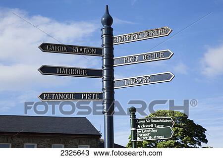 Directional sign for landmarks in a city against a blue sky; Bantry county cork ireland View Large Photo Image Stock Image - Directional sign for landmarks in a city against a blue sky; Bantry county cork ireland. Fotosearch