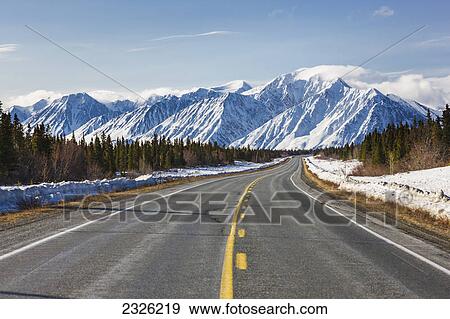 Stock Photo - Driver's view of the alaska highway southwest of kluane lake; Yukon canada. Fotosearch
