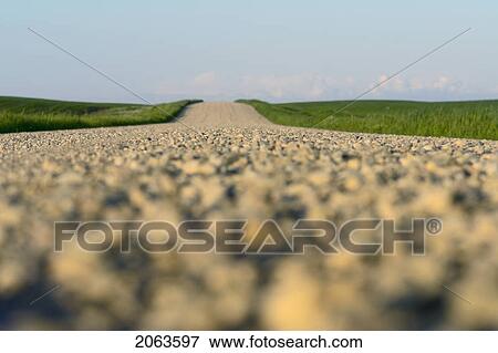Extreme Low Angle Of Gravelled Country Road; Canada, Manitoba, Erickson View Large Photo Image Stock Photo - Extreme Low Angle Of Gravelled Country Road; Canada, Manitoba, Erickson. Fotosearch