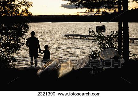 Father And Daughter Watch A Sunset On Beech Hill Pond; Otis Maine United States Of America View Large Photo Image Stock Image - Father And Daughter Watch A Sunset On Beech Hill Pond; Otis Maine United States Of America. Fotosearch