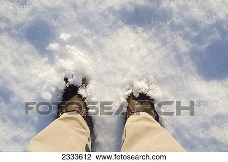 Stock Image - Feet in the snow; Ascona ticino switzerland. Fotosearch