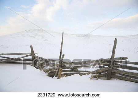 Fence and hill of snow in winter; Caledon ontario canada View Large Photo Image Stock Image - Fence and hill of snow in winter; Caledon ontario canada. Fotosearch
