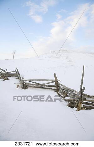Fence and hill of snow in winter; Caledon ontario canada View Large Photo Image Stock Image - Fence and hill of snow in winter; Caledon ontario canada. Fotosearch