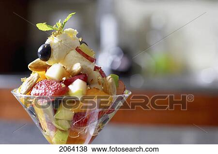 Stock Photo - Festive Fruit Cocktail With Mascarpone Cheese In A Martini Glass. Fotosearch