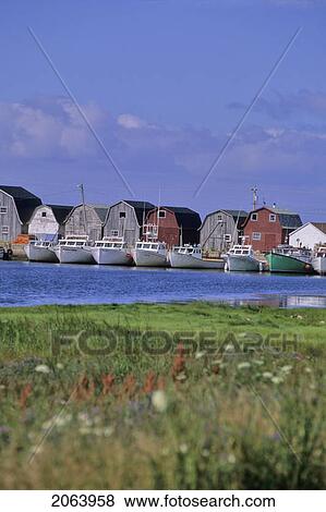 Stock Photo - Fishing Shacks Line The Bay At Malpeque Harbour, Pei. Fotosearch