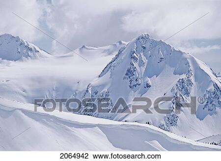 Stock Image - Fissile Mountain, Daytime, Covered In Winter Snow, Whistler, B. C.. Fotosearch