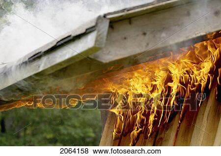 Stock Photo - Flames And Smoke Burn Up Roof Of Shed, Hamilton, Ontario. Fotosearch
