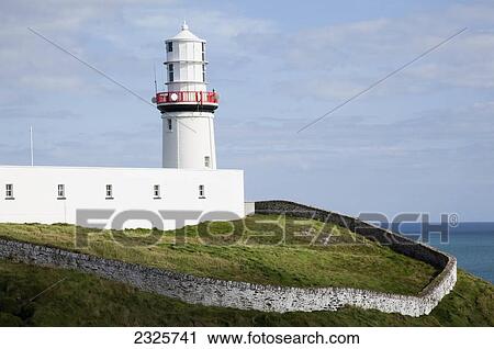 Stock Image - Galley head lighthouse near awnehincha; County cork ireland. Fotosearch