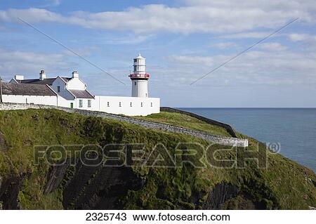 Stock Image - Galley head lighthouse near awnehincha; County cork ireland. Fotosearch