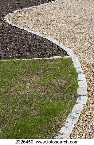 Garden floor divided with three different elements grass soil and pebbles; Coulsdon south surrey england View Large Photo Image Stock Image - Garden floor divided with three different elements grass soil and pebbles; Coulsdon south surrey england. Fotosearch