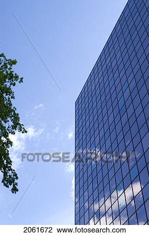 Glass Pane Office Building With Blue Sky And Clouds, Winnipeg, Canada View Large Photo Image Stock Image - Glass Pane Office Building With Blue Sky And Clouds, Winnipeg, Canada. Fotosearch