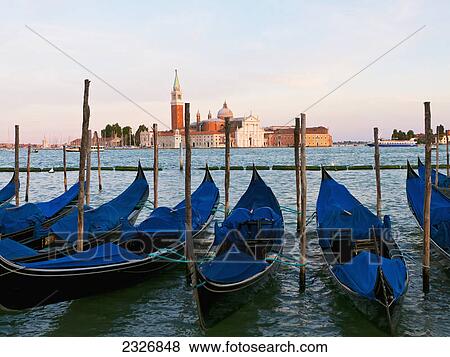 Stock Photo - Gondolas on the grand canal by st mark's square (piazza san marco) looking across to isola di san giorgio maggiore; Venice italy. Fotosearch