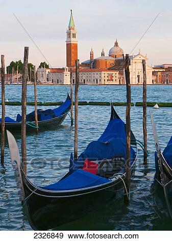 Stock Photo - Gondolas on the grand canal by st mark's square (piazza san marco) looking across to isola di san giorgio maggiore; Venice italy. Fotosearch